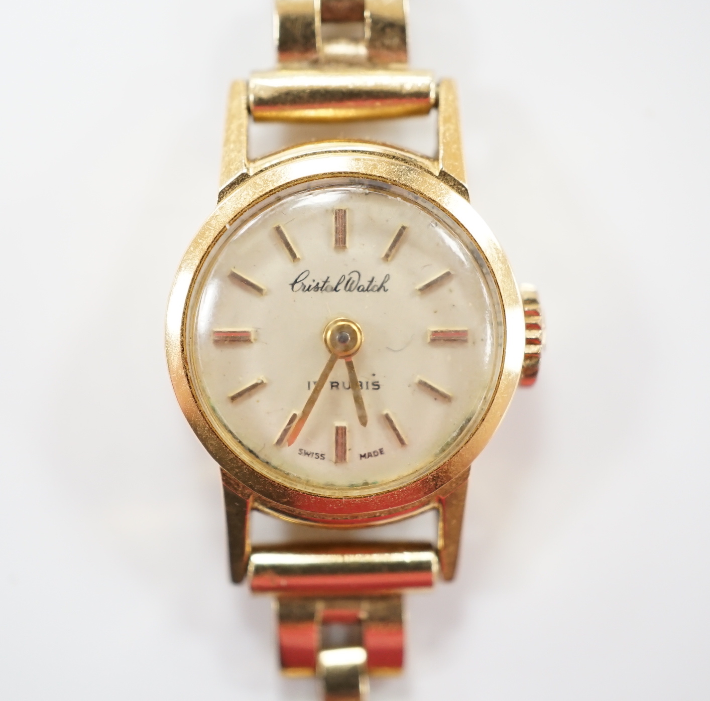 A lady's 18ct gold manual wind Cristal Watch, on a 1960's 9ct gold bracelet, overall length 16cm